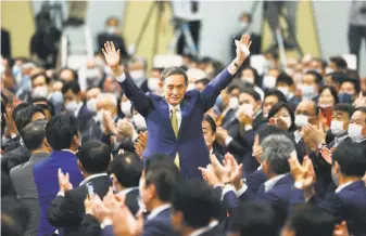  ?? Kyodo News ?? Yoshihide Suga acknowledg­es party members meeting in Tokyo after he was chosen to lead the ruling Liberal Democratic Party. He is expected to be elected prime minister on Wednesday.