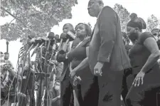  ?? MARK HOFFMAN/ MILWAUKEE JOURNAL SENTINEL ?? Julia Jackson, mother of Jacob Blake, is flanked by attorney Benjamin Crump and family members at a news conference Tuesday.