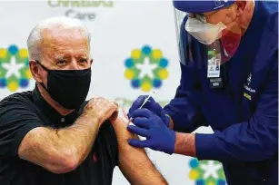  ?? Susan Walsh / Associated Press ?? President-elect Joe Biden receives his second dose of the coronaviru­s vaccine — three weeks after getting his first — at Christiana­care Christiana Hospital in Newark, Del., on Monday.