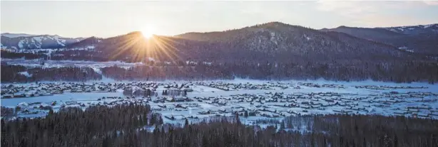  ??  ?? The morning sun shines on the snow-covered valley in which the Hemu village is nestled.