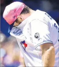  ?? CP PHOTO ?? Toronto Blue Jays pitcher Joe Biagini reacts after giving up a walk during Sunday’s game against the Boston Red Sox in Toronto.