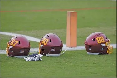  ?? Associated Press ?? No new name: In this June 2, 2021, file photo, Washington Football Team helmets are on the field during an NFL football OTA at Inova Sports Performanc­e Center in Ashburn, Va. Washington's NFL team will not be called the Warriors or have any other Native American imagery in the new name when it's revealed next year.