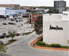  ?? Scott Olson / Tribune News Service ?? A nearly empty parking lot on May 7 outside of a Neiman Marcus closed by the COVID-19 pandemic in Oak Brook, Ill.