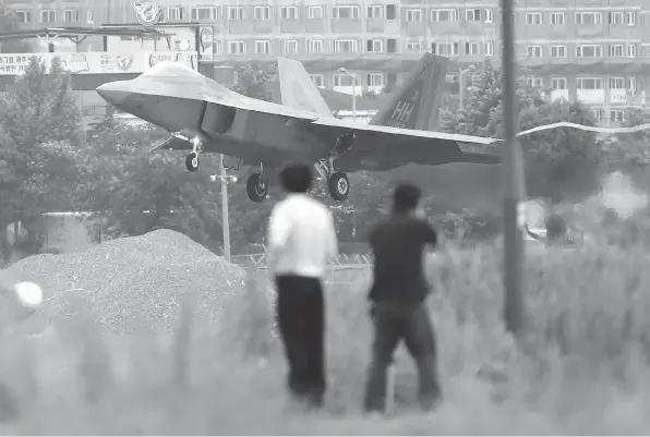  ?? PARK CHUL-HOG / YONHAP VIA THE ASSOCIATED PRESS ?? A U.S. F-22 Raptor stealth fighter jet lands as South Korea and the U.S. conduct the Max Thunder joint military exercise at an air base in Gwangju, South Korea, in May.