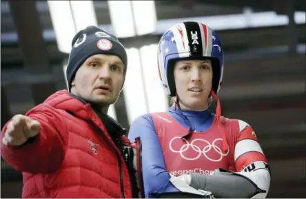  ?? AP PHOTO/WONG MAYE-E ?? Erin Hamlin of the United States and her coach Lubomir Mick discuss the course before a training run at the 2018Winter Olympics in Pyeongchan­g, South Korea, Saturday, Feb. 10, 2018.