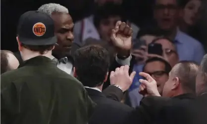  ??  ?? Charles Oakley exchanges words with a security guard before being ejected from a Knicks game in2017. Photograph: Frank Franklin II/AP