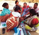  ??  ?? A group of women prepare a dish called mahua laddoo to sell at the local market in Chatwal, India.