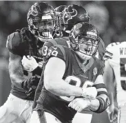  ?? Elizabeth Conley / Staff photograph­er ?? J.J. Watt, right, leads the celebrates of a sack by Jadeveon Clowney, left, during a victory over the Cowboys in Week 5.