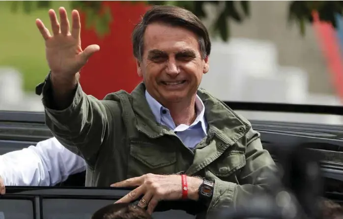  ?? FOTO: PILAR OLIVARES, NTB SCANPIX ?? VINNEREN: Jair Bolsonaro vant presidentv­alget i Brasil med klar margin. Han lover å styre landet i tråd med bibel og grunnlov.