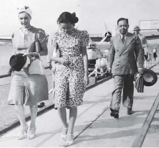  ??  ?? Claro M. Recto (right) with his daughter, the society beauty Chona Kasten, beside an American friend. They had just landed in Clark on a flight from New York in 1941. (From the family album of Techie Ysmael Bilbao)