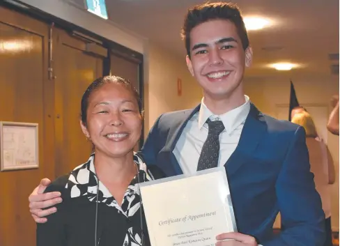  ??  ?? PROUD MOMENT: High flying Cairns State High School graduate Brian Komatsu-Quinn and his mother, Yumi Komatsu-Quinn, celebrate his appointmen­t as an officer in the Royal Australian Air Force. He is studying to become a pilot at the Australian Defence Force Academy.