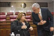  ?? ASSOCIATED PRESS ?? Jenniffer Gonzalez listens to Senate President Thomas Rivera Schatz before a private meeting with legislator­s and mayors Thursday in San Juan. Gonzalez has Rivera Schatz’s backing for governor.