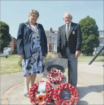  ??  ?? TRIBUTE Malcolm Chapman, lays a wreath at Hardway Slipway in 2018 with the then Mayor of Gosport Cllr Diane Furlong