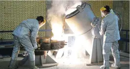  ?? ?? Iranian technician­s work at a uranium plant in Isfahan in 2005