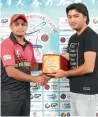  ?? Supplied photo ?? NMC’s Abid Ali (left) recieves the man-of-the-match trophy. —