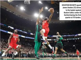  ??  ?? HOUSTON ROCKETS guard James Harden (13) drives to the basket against Boston Celtics center Al Horford during the first quarter at TD Garden.
