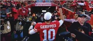  ?? Bay Area News Group/tns ?? San Francisco 49ers’ quarterbac­k Jimmy Garoppolo (10) is greeted by fans as he walks off the field after defeating the Minnesota Vikings during their NFC divisional playoff game at Levi’s Stadium in Santa Clara on Jan. 11. The San Francisco 49ers defeated the Minnesota Vikings 27-10. BELOW: San Francisco 49ers’ Dee Ford (55) gets up after sacking Minnesota Vikings quarterbac­k Kirk Cousins (8) in the second quarter of their NFC divisional playoff game at the Levi’s Stadium in Santa Clara on Jan. 11.