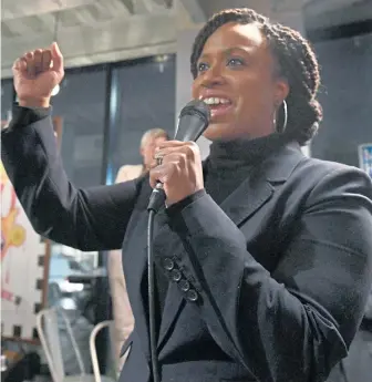  ?? JIM MICHAUD / BOSTON HERALD ?? ‘OUR FINEST HOUR’: U.S. Rep.-elect Ayanna Pressley leads a cheer at a Monday rally at Dudley Cafe in Roxbury.