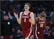  ?? HARRY HOW — GETTY IMAGES ?? Alabama's Grant Nelson scored 19of his 24points against North Carolina in the second half and blocked a last-second shot to seal the win.