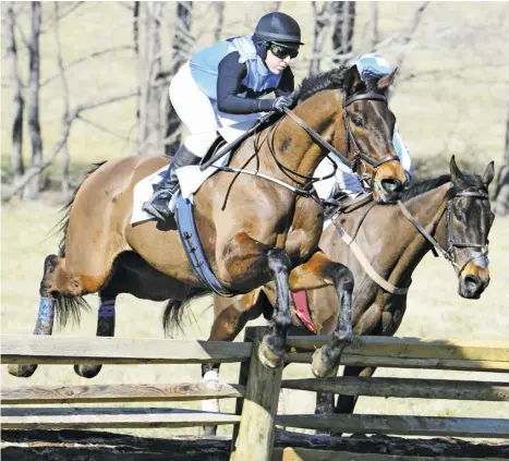  ?? ?? Left: Rider Elizabeth Scully and the Forrest Kelly-trained Fletched (at left) jumped to win their second-straight open timber at the Rappahanno­ck Hunt Point-to-Point.