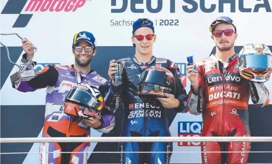  ?? ?? Second-placed Ducati Pramac French rider Johann Zarco, first-placed Monster Energy Yamaha's French rider Fabio Quartararo and third-placed Ducati Lenovo Australian rider Jack Miller (also inset) celebrate on the podium after the German Motogp Grand Prix at the Sachsenrin­g racing circuit in Hohenstein-ernstthal, near Chemnitz, in eastern Germany. Pictures: Ronny Hartmann/afp