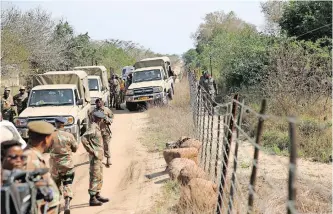  ?? News Agency (ANA) | MOTSHWARI MOFOKENG African ?? MOZAMBICAN soldiers patrolling their side of the border with the SANDF at Manguzi border post base.