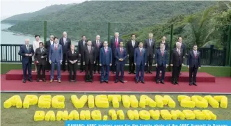  ??  ?? DANANG: APEC leaders pose for the family photo at the APEC Summit in Danang, Vietnam yesterday. — AP