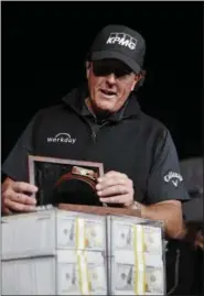  ?? JOHN LOCHER - THE ASSOCIATED PRESS ?? Phil Mickelson celebrates after defeating Tiger Woods in a golf match at Shadow Creek golf course, Friday, Nov. 23, 2018, in Las Vegas.