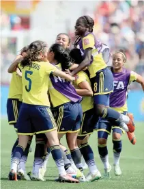  ??  ?? YISELA CUESTA #18 of Colombia and the rest of the team celebrate the win over France during the FIFA Women’s World Cup 2015 Group F match at Moncton Stadium on June 13 in Moncton, Canada.