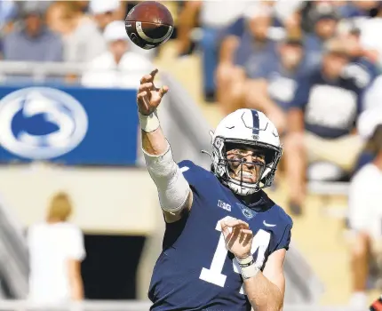  ?? BARRY REEGER/AP ?? Penn State quarterbac­k Sean Clifford passes against Ball State during the first half Saturday.