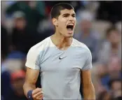  ?? JEAN-FRANCOIS BADIAS — THE ASSOCIATED PRESS ?? Carlos Alcaraz, above, is now 18-1this season after beating Albert Ramos-Vinolas in the French Open on Wednesday.