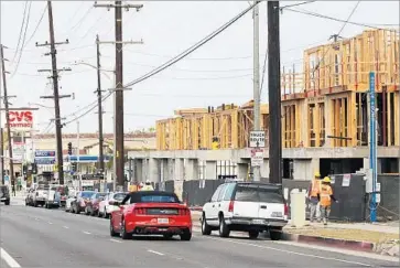  ?? Los Angeles Times ?? THE ACTION by Redondo Beach, which passed unanimousl­y Tuesday, puts a brake on projects that combine retail and office space with housing. Above, a complex under constructi­on in the city on Pacific Coast Highway.