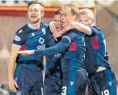  ??  ?? Billy Mckay and team-mates celebrate his late winner for the Staggies.