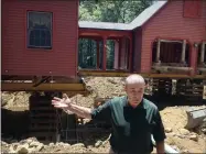  ?? TED SHAFFREY ?? In this July 1, 2019photo, Peter Brenn gestures toward his raised house in Willington, Conn. The concrete foundation of his home is being replaced with money from a state grant program. The foundation had been deteriorat­ing due to the presence of an iron sulfide known as pyrrhotite, often described as “a slow-moving disaster,” which causes concrete to crack and break gradually as it becomes exposed to water and oxygen.