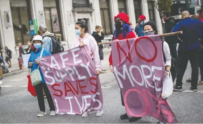  ?? DARRYL DYCK/THE CANADIAN PRESS ?? Demonstrat­ors call for a safe supply of illicit drugs on Internatio­nal Overdose Awareness Day, Aug. 31, in Vancouver last year. More than 200 people have died every month over the past few months from illicit drug overdoses.