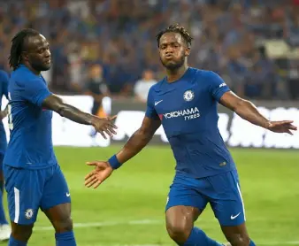  ?? — AFP ?? Chelsea’s Michy Batshuayi (right) celebrates after scoring against Arsenal on Saturday. Chelsea won 3-0.