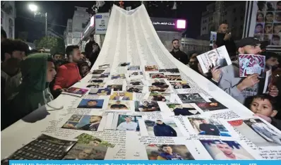  ?? — AFP ?? RAMALLAH: Palestinia­ns protest in solidarity with Gaza in Ramallah, in the occupied West Bank, on January 1, 2024.