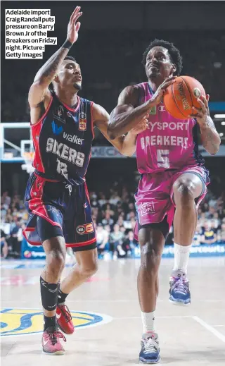  ?? Picture: Getty Images ?? Adelaide import Craig Randall puts pressure on Barry Brown Jr of the Breakers on Friday night.