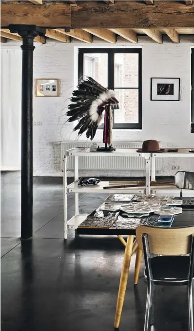  ??  ?? This page
An original Lakota headdress shares space with a speaker system, commuter bicycle and selection of design references — a scene that accurately reflects Young’s lifestyle