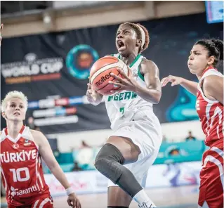  ??  ?? Sarah Ogoke (7) of Nigeria goes for a dunk against Turkey at the ongoing FIBA Women's Basketball World Cup Group B match at Santa Cruz de Tenerife -Quico Cabrera Arena, Spain on Septemer 23, 2018