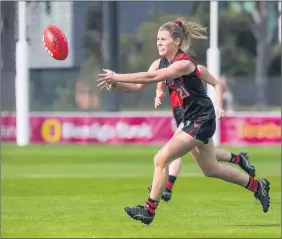  ??  ?? STANDOUT: Warracknab­eal’s Alex Morcom in action for Essendon in the VFLW. Morcom won runner-up honours in this year’s best-andfairest count.