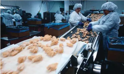  ?? ?? Workers at a Tyson Foods factory in Springdale, Arkansas, where a protest took place earlier this week. Photograph: Gregory Smith/ Corbis/Getty Images