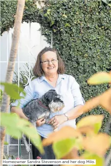  ??  ?? Homeowner Sandra Stevenson and her dog Milo.