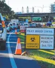  ??  ?? GRIDLOCK: Checks at the Queensland border impact on the community.