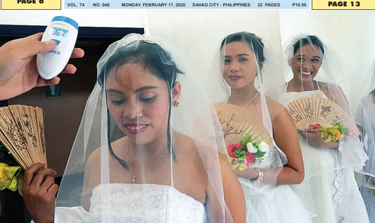  ?? BING GONZALES ?? AS PART of the precaution­ary measures against the COVID-19 threat, these blooming brides get their body temperatur­e checked before entering the venue for the Pag-IBIG Fundinitia­ted mass wedding at Ritz Hotel at Garden Oases last Friday.