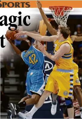  ?? AP ?? DENVER’S Timofey Mozgov (front right) and Jordan Hamilton block New Orleans’ Lance Thomas in their gamewon by the Nuggets, 102-84.