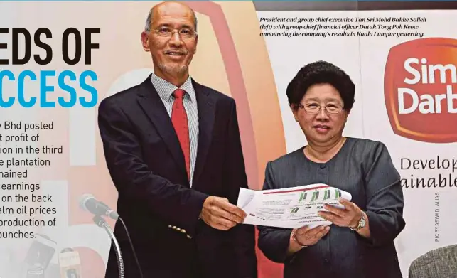  ??  ?? President and group chief executive Tan Sri Mohd Bakke Salleh (left) with group chief financial officer Datuk Tong Poh Keow announcing the company’s results in Kuala Lumpur yesterday.