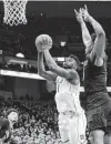  ?? Andy Lyons / Getty Images ?? Zion Williamson had 27 points and 12 rebounds to power No. 2 Duke to a come-from-behind win over No. 16 Louisville.