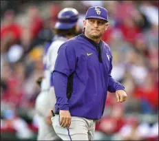  ?? (NWA Democrat-Gazette/Hank Layton) ?? LSU Coach Jay Johnson paid respect to Arkansas’ ace left-hander Hagen Smith and right-handed reliever Will McEntire on Thursday after the Razorbacks’ 7-4 win over the Tigers at Baum-Walker Stadium in Fayettevil­le.