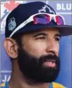  ?? NATHAN DENETTE, THE CANADIAN PRESS ?? Jose Bautista speaks with reporters at Blue Jays spring training camp in Dunedin Friday.